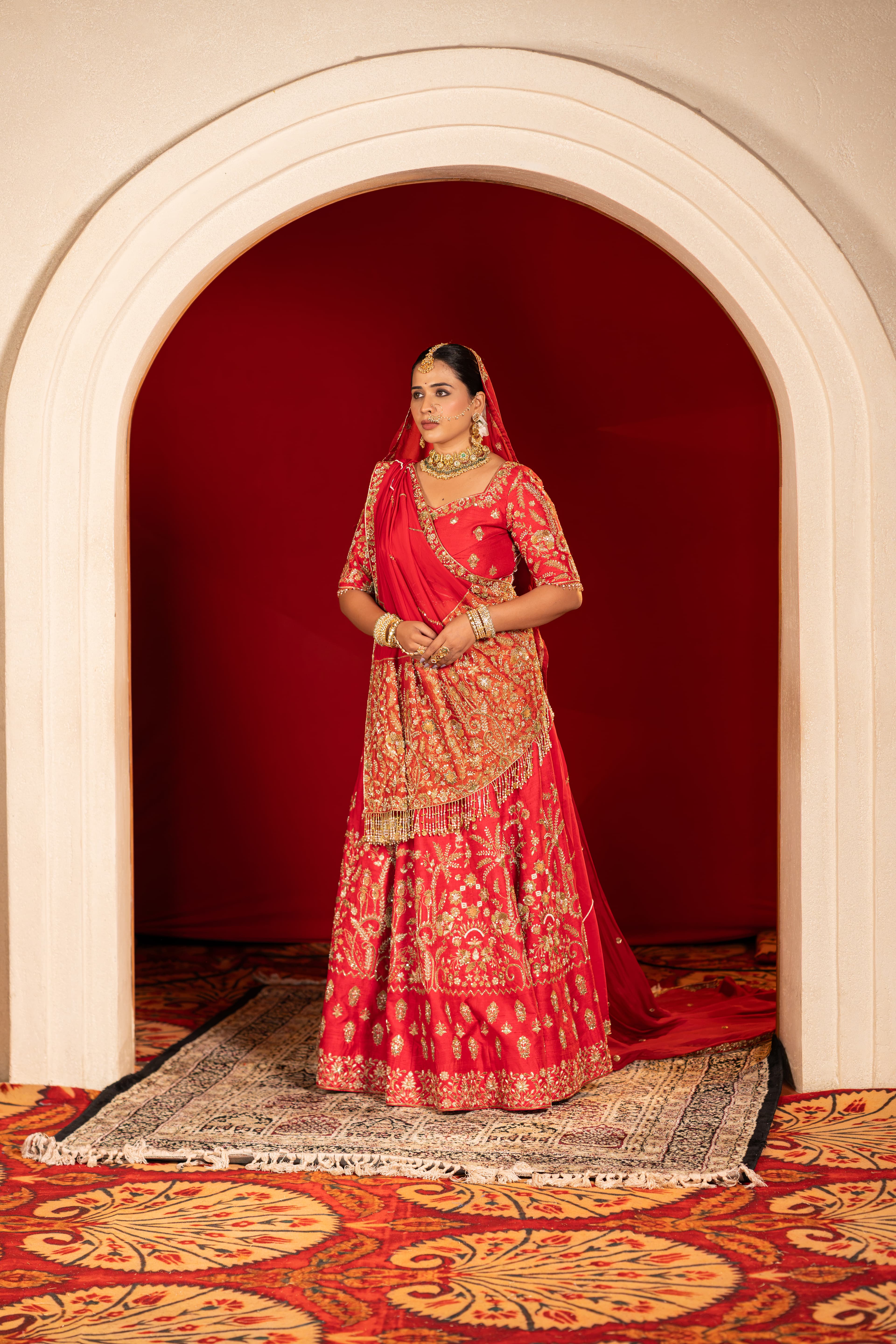 Reddish-Pink Bridal Lehenga with Handwork Detail