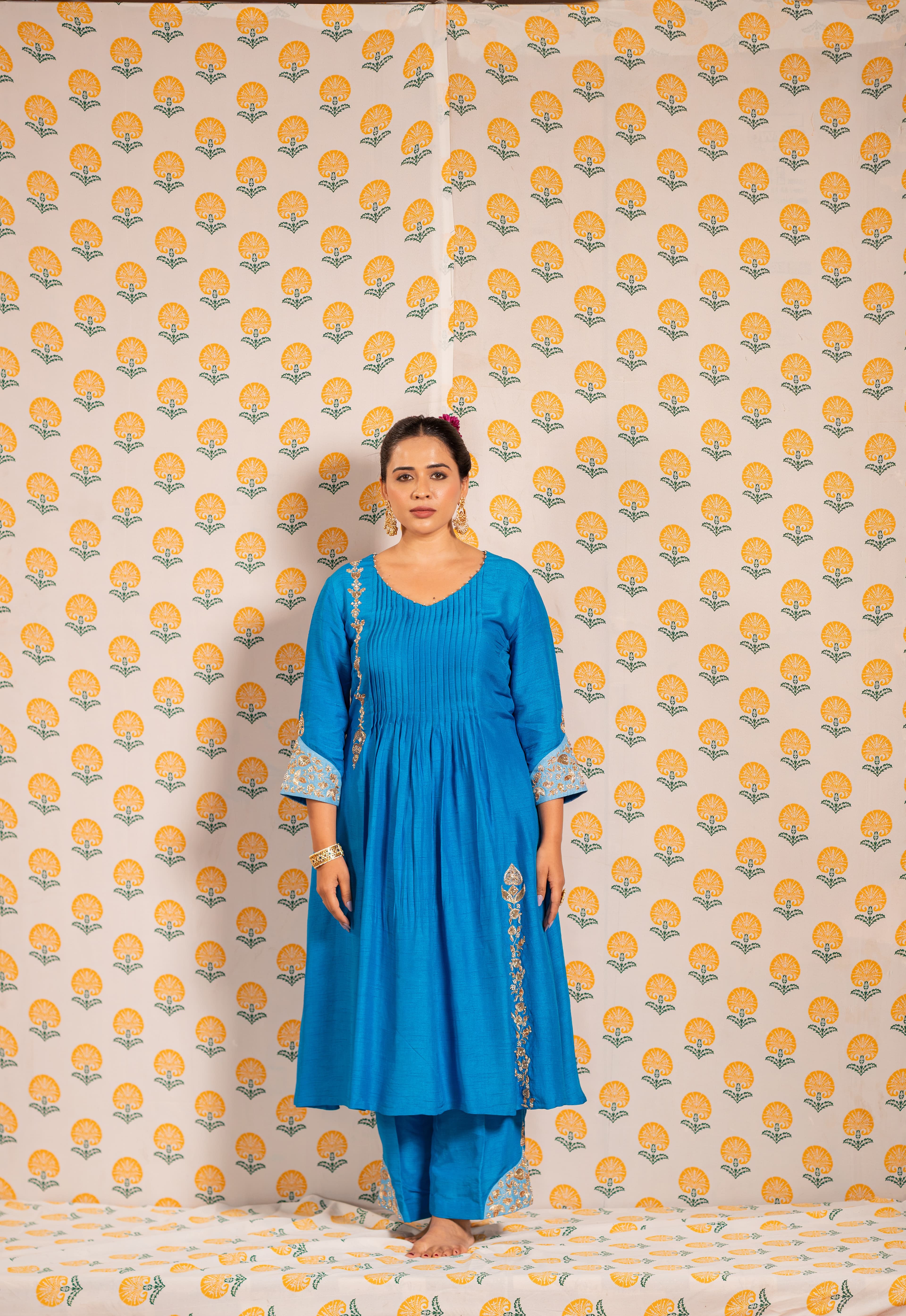 Blue Aline kurta set with soft pleats and delicate embroidery on it.