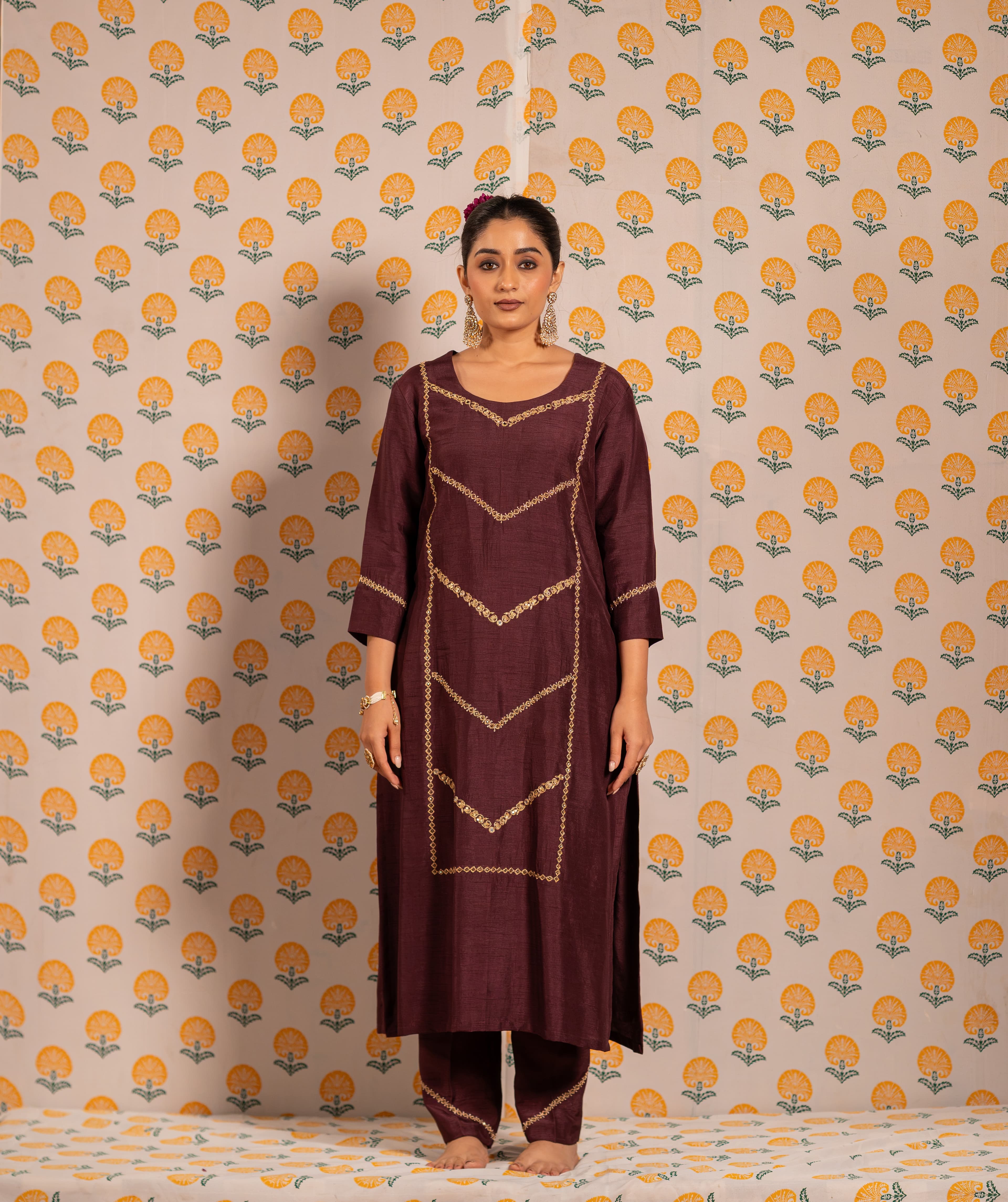 A deep wine kurta set featuring fine geometric handwork