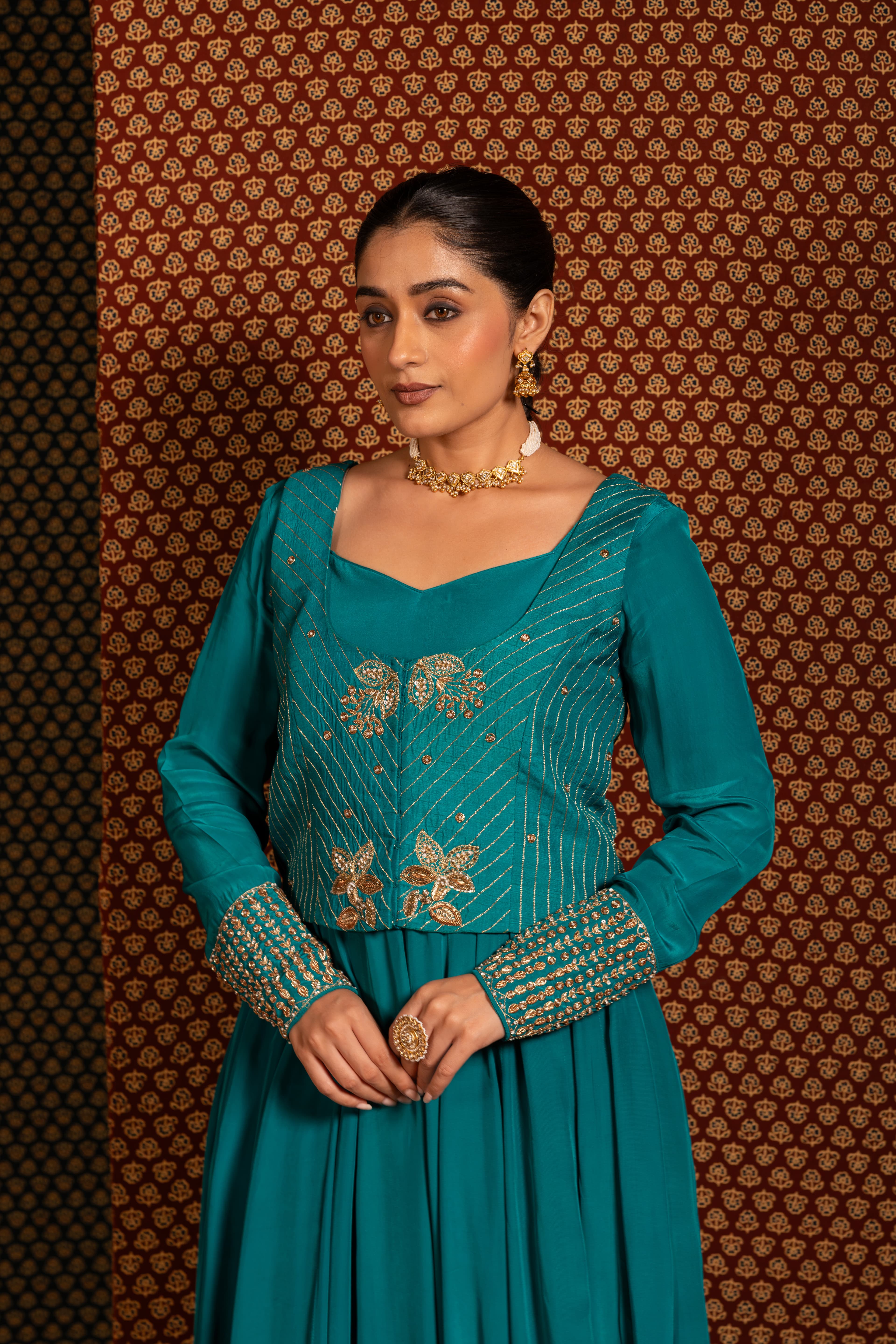 Craftsmanship detail — Teal Green Anarkali set paired with a jacket, featuring intricate traditional handwork