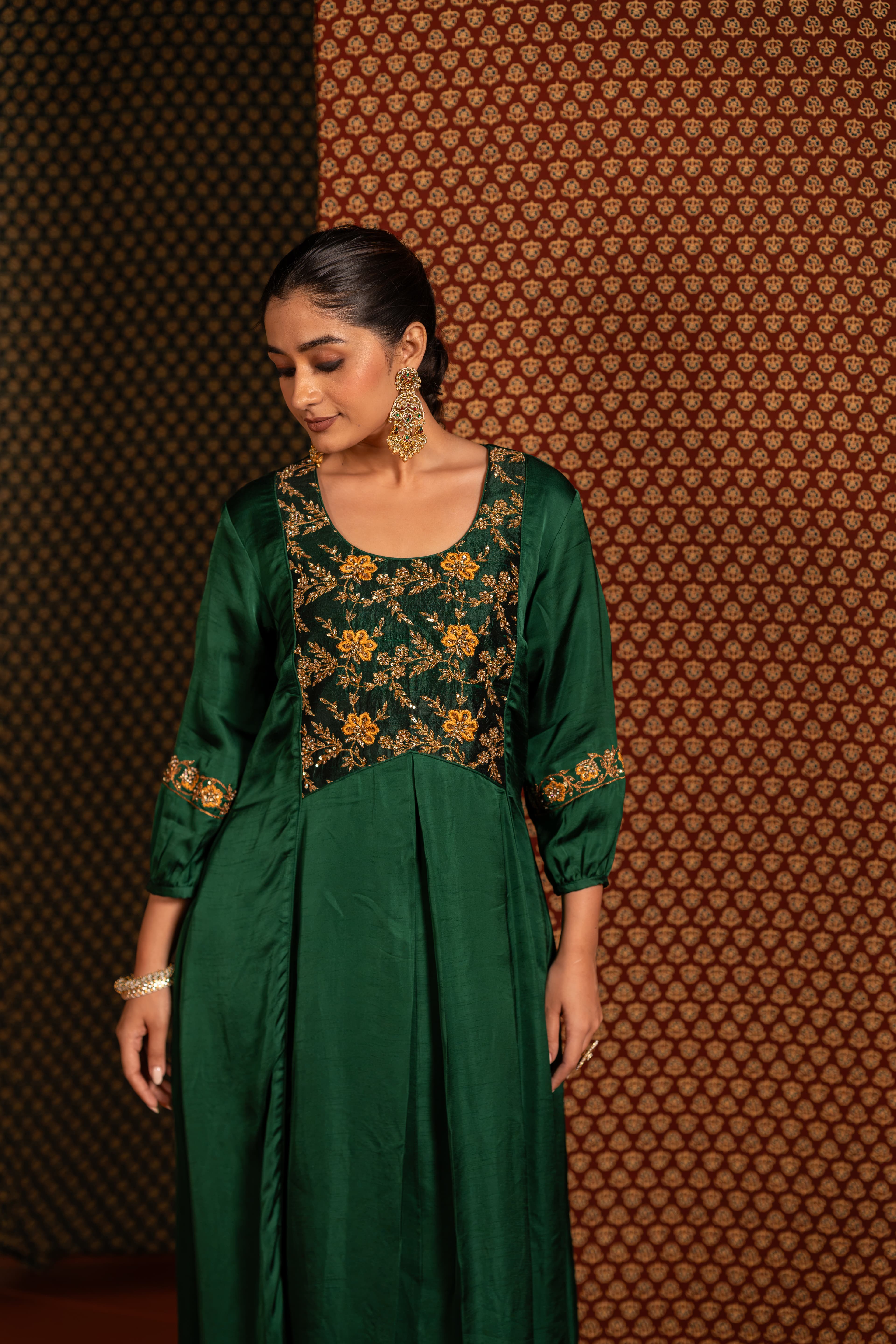 Craftsmanship detail — Green Aline kurta set with intricate handwork featuring vibrant yellow floral motifs